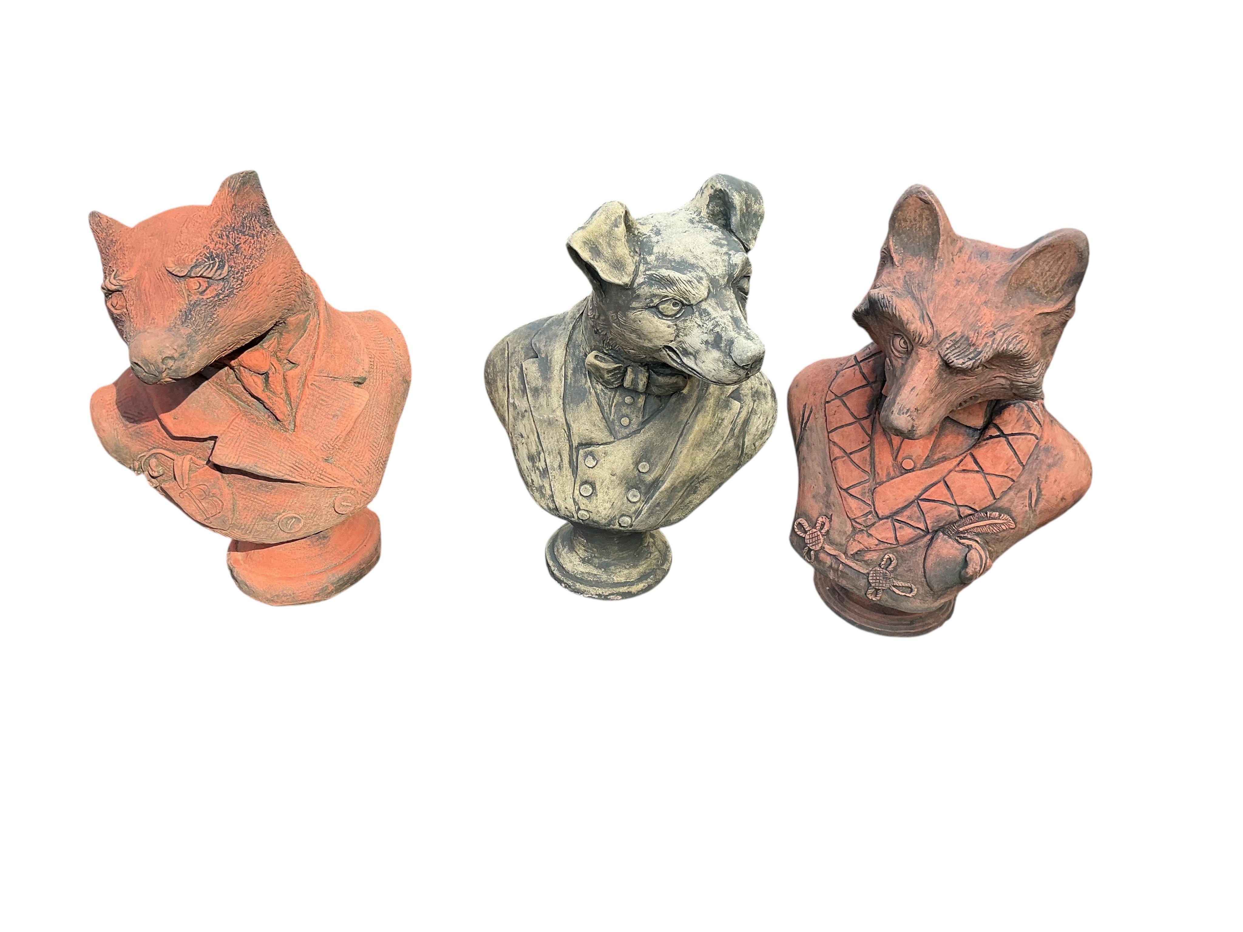 Three cast stone fox, badger and hound busts, largest height 41cm